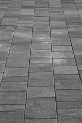 Wall Mural - Dark gray granite tiled floor pattern texture perspective view background.  grey Square Tiles flooring with a lined Perspective view.  empty copy space for inscription. city park, urban scene