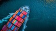 © COK House - A colorful container ship sails diagonally across deep blue sea, leaving a wake of ripples. The vibrant cargo contrasts against the serene waters, symbolizing maritime commerce.