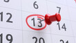 © Rawf8 - Red pin on marked calendar day 13, closeup view.  Friday the 13th concept.