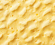 © hajiran  - A top-down view of a yellow cheese texture, highly detailed with intricate patterns, offering a clear, smooth surface captured in high-resolution photography.