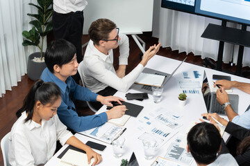Leinwandbilder - Project manager communicate and collaborate with team using project management software display on monitor, tracking progress of project task and making schedule plan at meeting table. Prudent