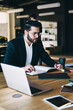 © BullRun - Business people working at table in office
