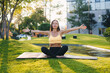 © Strelciuc - A woman is practicing yoga outdoors in a tranquil and peaceful setting amidst nature