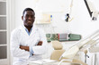 © JackF - Positive african american dentist doctor in his clinic