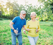 © Lumos sp - outdoor senior fitness woman man lifestyle active sport exercise healthy fit couple running jogging elderly mature having fun water bottle talking together friend hug break