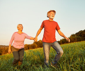 Wall Mural - woman man outdoor senior couple happy lifestyle retirement together smiling love old nature mature e