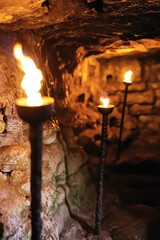 Poster - Group of candles illuminated in a dark cave setting, great for use in horror or suspense scenes