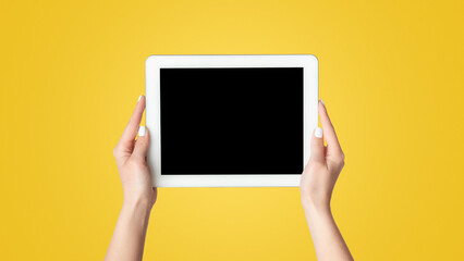 Poster - Cropped view of millennial girl showing tablet computer with mockup for design on screen against white background, panorama