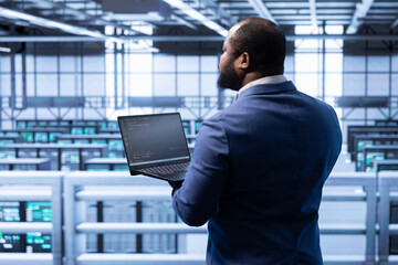 Poster - it staff member in data center implementing backup solutions to protect against infrastructure data 
