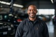 © Baba Images - Portrait of a middle aged African American car mechanic in workshop