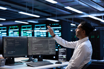 Poster - software developer looking at holograms in data center, monitoring infrastructure. man in server roo