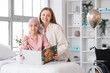 © Pixel-Shot - Little girl after chemotherapy with mother reading book at hospital. Childhood cancer awareness concept