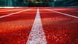 © Duka Mer - A closeup reveals a red running track with a white line texture background.