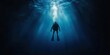 © PICK YOUR POV - A diver exploring the depths of the ocean, surrounded by shafts of light.