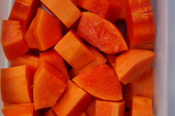 Wall Mural - Papaya cut into pieces, ready to eat