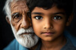 © Hamzah - Generations of Wisdom: A poignant portrait of an elderly man and a young boy, their eyes locked in a shared gaze. The image captures the essence of intergenerational connection.