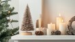 © MetaPixel - Christmas themed mockup featuring a wooden tree, candles, and holiday decor arranged on a white table for festive styling inspiration