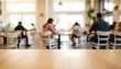 © peemee19 - Busy cafe interior, people enjoying a meal or meeting