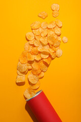 Wall Mural - Potato chips with a red tube on a yellow background