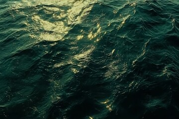 Wall Mural - glimmering ocean waves at sunset with reflections of light on the water surface captured in rich ton