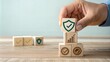 © Tekin - Hand put a wooden cube block with identity proof icon for security protection system on wood table. Certified guarantee approval or secure access system concept. Quality assurance of business service.