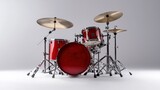 A drum set with red drums and silver cymbals.