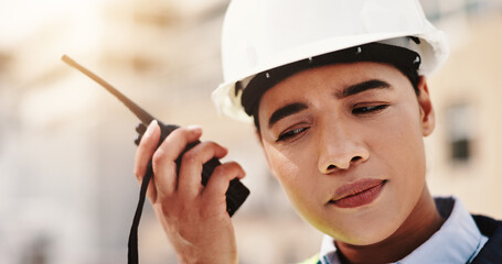 Poster - Woman, engineer and construction site with radio, listen and communication for project or safety. Female person, technology and helmet for development, infrastructure and industry in quality control