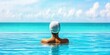 © CoreVisuals - florida sports relaxation concept. A serene scene of a person relaxing in a tranquil pool, gazing at a beautiful turquoise ocean under a clear blue sky.