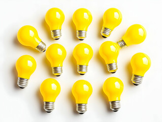 Poster - A vibrant collection of yellow light bulbs arranged artistically on a white background, symbolizing creativity and innovation.