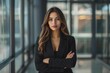 © Cloudyew - A woman in a black suit is standing in a hallway