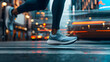 © Zyariss - Runner's feet in motion, city street.