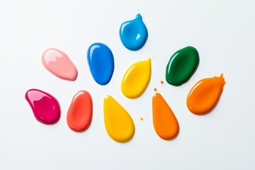 Poster - Collection of colorful paint droplets on a white background. The colors are bright and vibrant, creating a cheerful and lively atmosphere