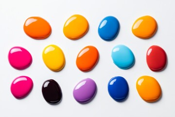 Poster - Row of colorful paint balls are arranged in a line. The colors include red, orange, yellow, green, blue, and purple. The arrangement of the balls creates a sense of harmony and balance