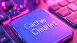 © Tomass - Neon keyboard with cache cleared key in purple lighting
