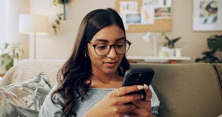 Poster - Woman, phone and relax on sofa with social media, connectivity and reading ebook in home. Girl, student or mobile in living room on study break, streaming service or text message for weekend planning