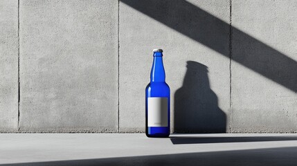 Aufkleber - Bold blue beer bottle with a simple white label, set against a smooth grey background for an elegant, modern product presentation.