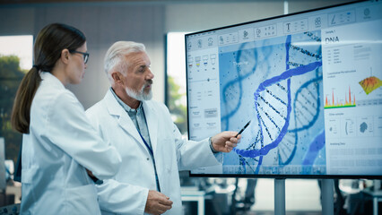 Aufkleber - Middle Aged Head of Laboratory Having a Meeting with a Female Chief Technologist in a Modern Biochemistry Lab. Colleagues Looking at a Screen and Having a Conversation About DNA Gene Editing