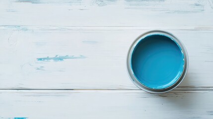 Poster - Blue paint can on white wooden surface top view with ample copy space for artistic or DIY design themes and projects.