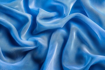 Close-up of blue mesh fabric, with waves and folds, against a vibrant blue background. 