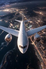 Wall Mural - An airplane flying over the Earth at night, with lights and city glow below