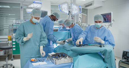 Poster - Wearing Sterile Gear in Operating Room, Multicultural Male and Female Surgical Team Collaborates with Steady Hands and Intense Focus, Executing a Surgery to Save Their Patient's Life