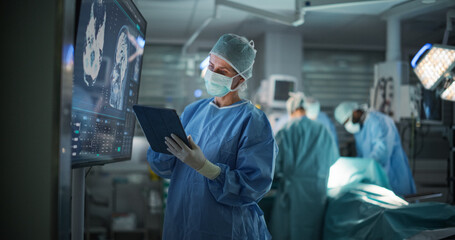 Aufkleber - Lead Surgeon Reviews Critical Brain Scans Displayed on a Monitor as Well as Health Data on a Tablet Computer. Her Team Preparing as She Plans the Surgical Approach for the Operation