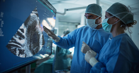 Aufkleber - Diverse Colleagues Having a Discussion In the Operating Room. Female and Male Surgeons Evaluate Complex Ultrasound Image on a Large Display, Strategizing the Next Steps for the Operation