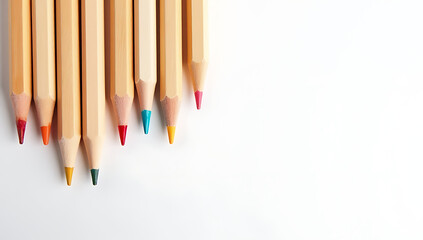 Poster - A set of wooden pencils is arranged by color on a clean white surface to demonstrate artistic creativity and learning._00001_