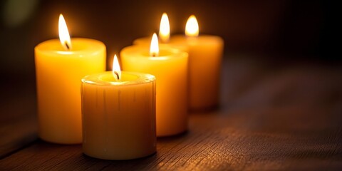 Aufkleber - Candle light illuminates a dark background, creating a warm and serene atmosphere. The soft glow of candle light enhances the mood and adds a touch of elegance to any setting.