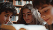 © forenna - Teenagers Whispering in Library with Open Book and Soft Lighting