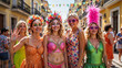 © Andrey - Group of friends in colorful carnival outfits posing in the street