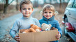 © Margo Miro - Cheerful children with bright smiles holding a box of stuffed animals near a car