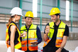 © NVB Stocker - coffee break together in warehous. Ethnic diversity worker people, Success teamwork. Group of professional engineering people wearing hardhat safety helmet meeting