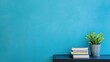 © Pimon - Modern Interior Design with Books and Potted Plant on Blue Wall Background